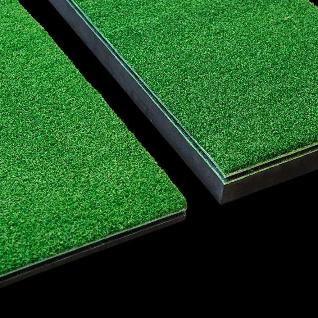 Two green artificial golf grass panels on a black background