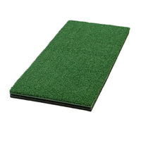 Green artificial golf grass mat on a white background
