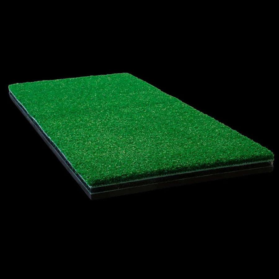 Green artificial golf grass mat on a black background