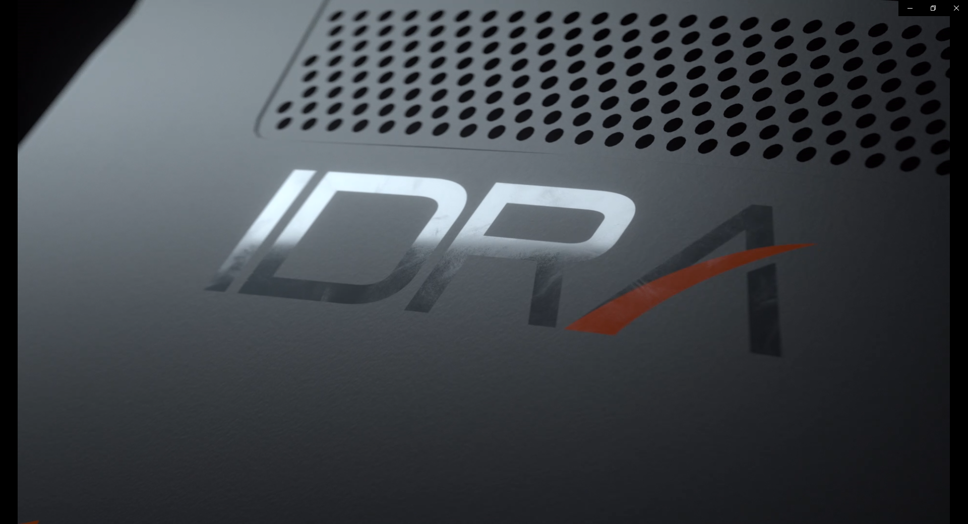 Close-up of a device with 'IDPA' logo on a dark background