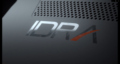 Close-up of a device with 'IDPA' logo on a dark background