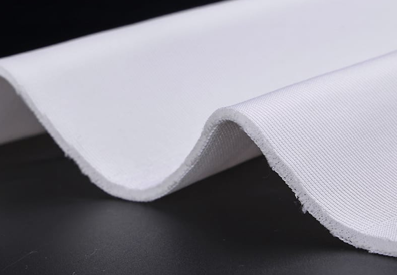Close-up of white fabric on a black background