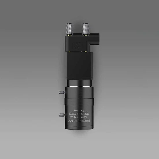 Black mechanical component on a gray background